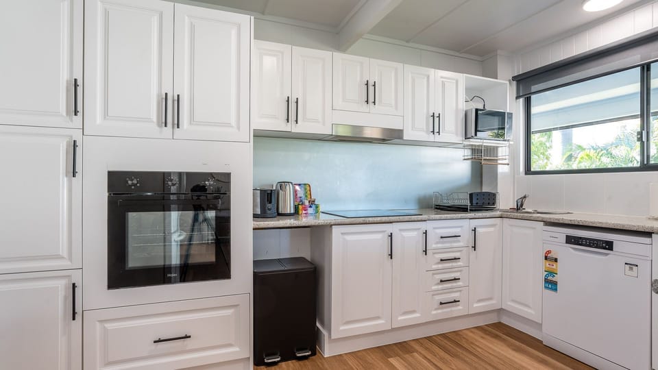 Fully equipped kitchen with modern appliances and ample storage