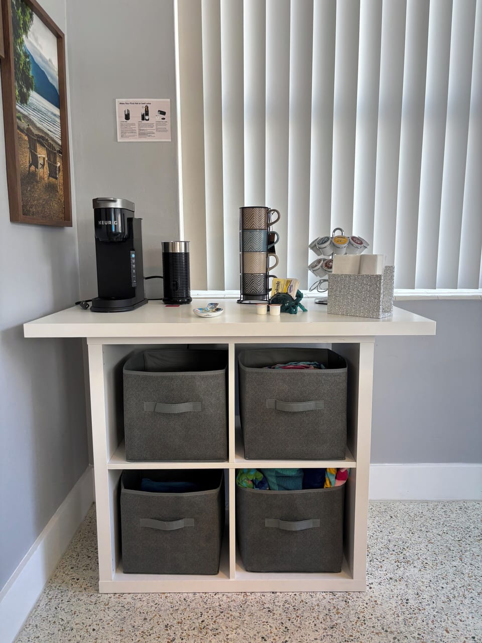 Coffee table with beach/pool towels in drawers.