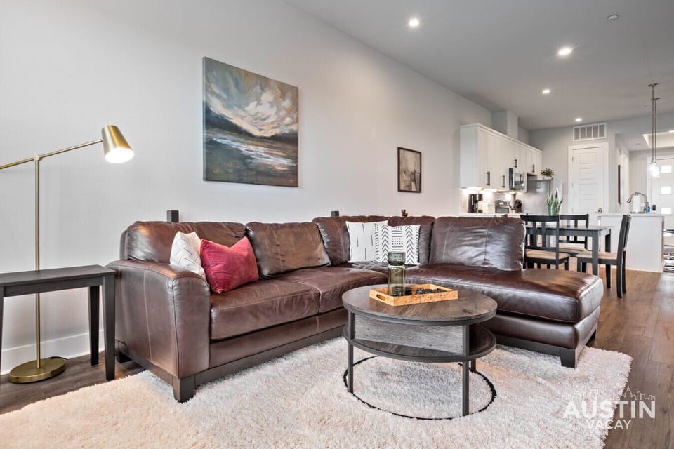 Modern open living room with plush seating.