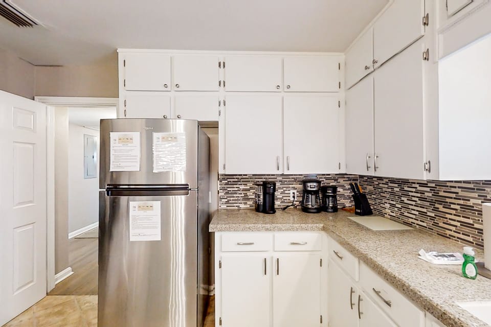 Fully equipped kitchen with appliances—ideal for extended stays and family meals.