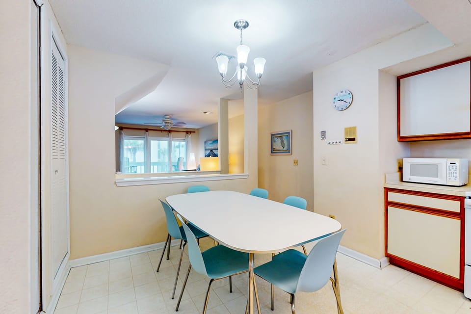 A fully equipped, spacious kitchen featuring an eat-in dining area.
