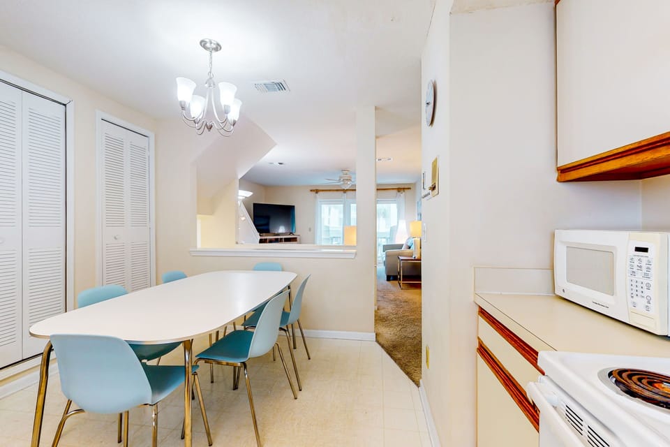A fully equipped, spacious kitchen featuring an eat-in dining area.