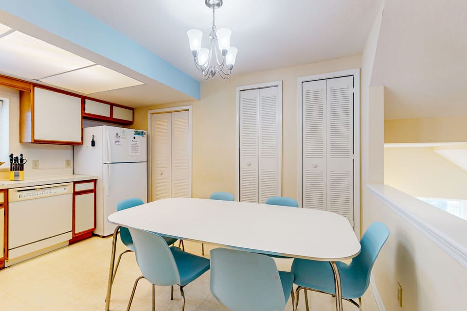 A fully equipped, spacious kitchen featuring an eat-in dining area.