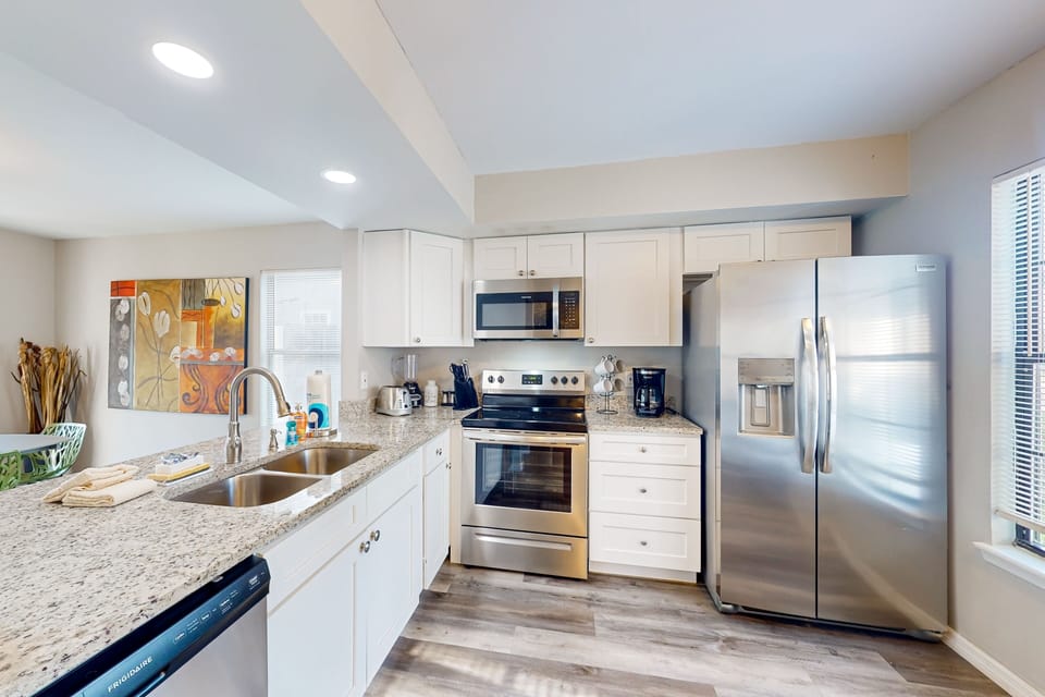 Fully equipped kitchen with appliances—ideal for extended stays and family meals.