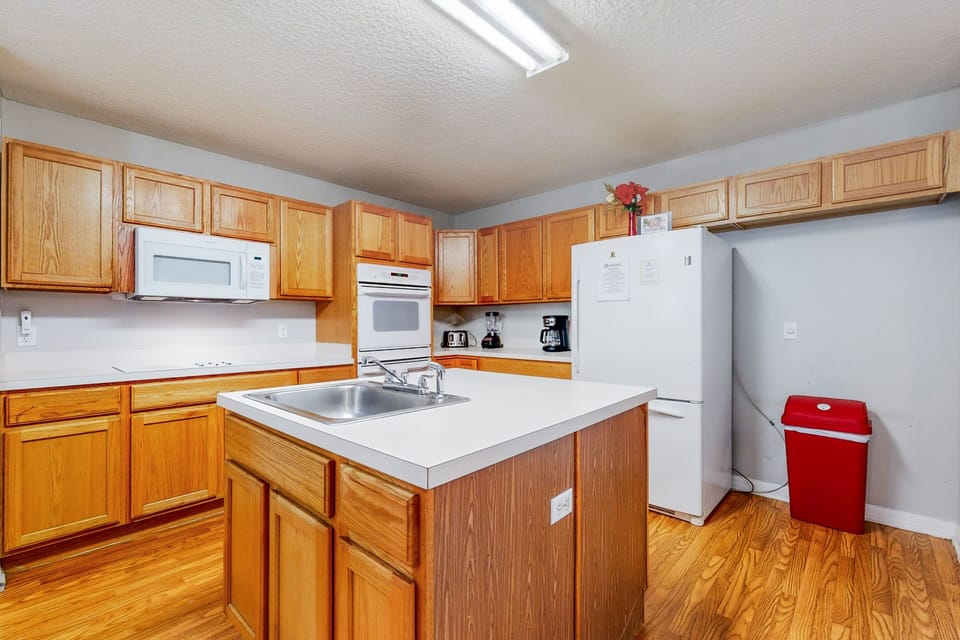 Fully equipped kitchen with appliances—ideal for extended stays and family meals.