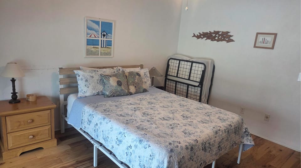 Second floor guest bedroom. Queen bed and roll away twin bed.