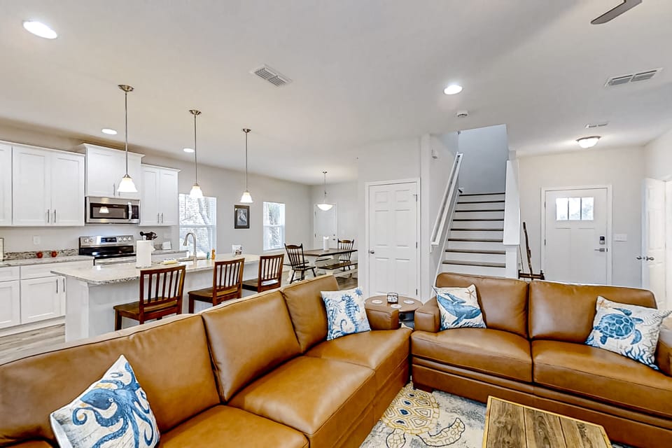 Enjoy an open-concept layout that flows seamlessly from the fully equipped kitchen to the inviting living room, complete with a streaming TV.