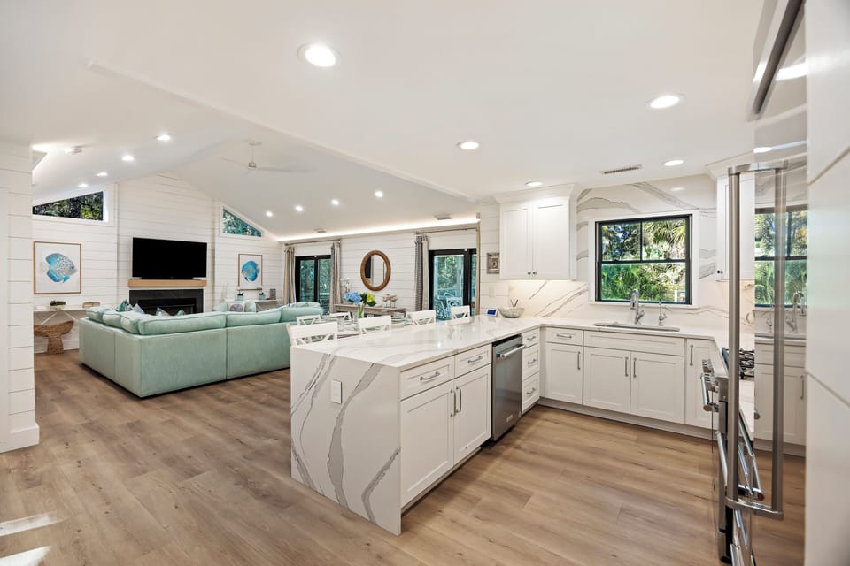Fully equipped kitchen with bar stools for extra seating