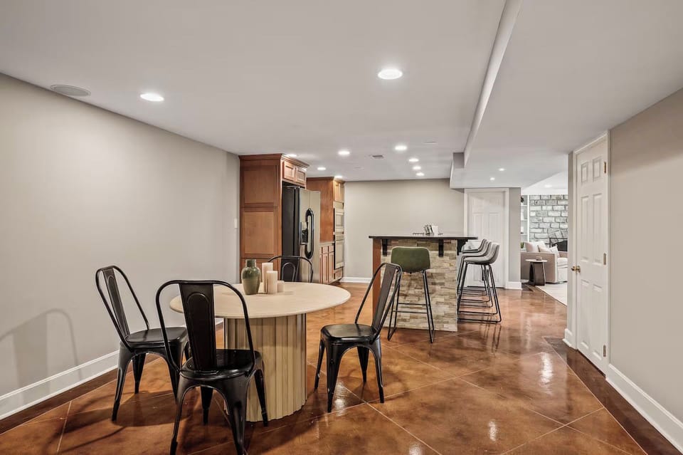 The lower level features cool concrete floors and dining space.
