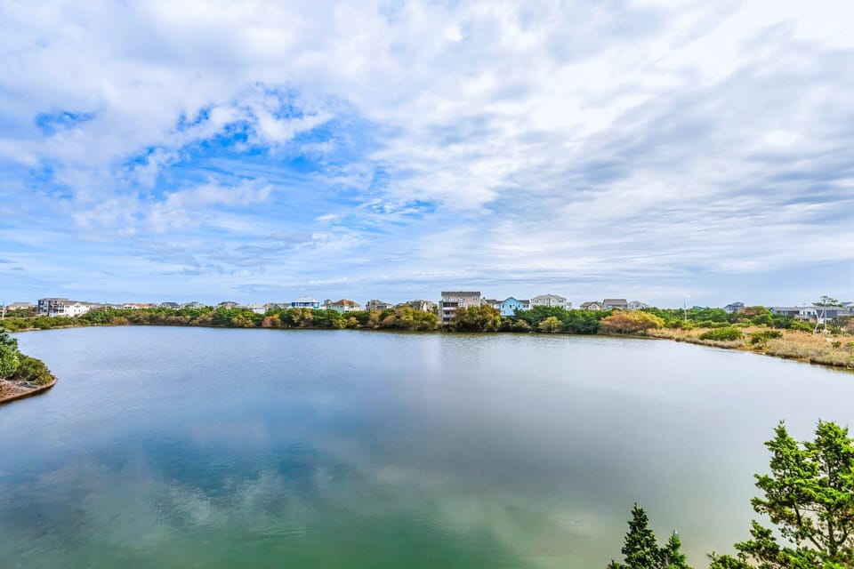 Deck with Partial Water Views: Sip your morning coffee or watch the sunset from this scenic sundeck.