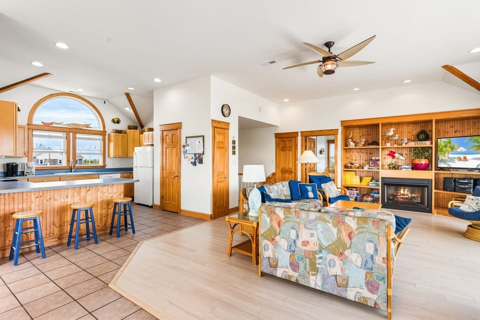 Living Area: Bright, open-concept living with cozy seating and Smart TV for family movie nights.