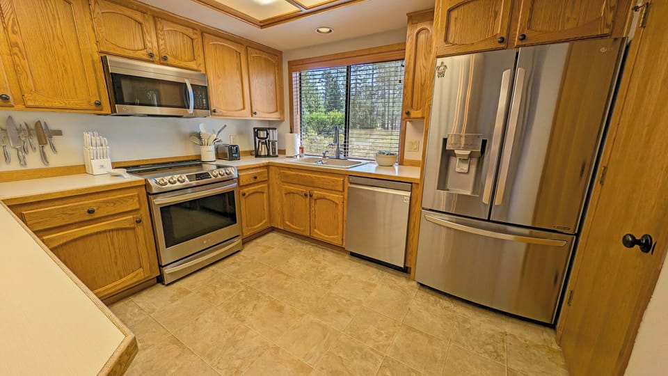 The Kitchen includes Stainless Steel appliances with glass top stove