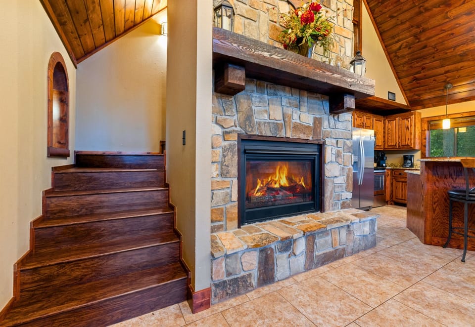 Warm stone fireplace for those perfect cabin nights.