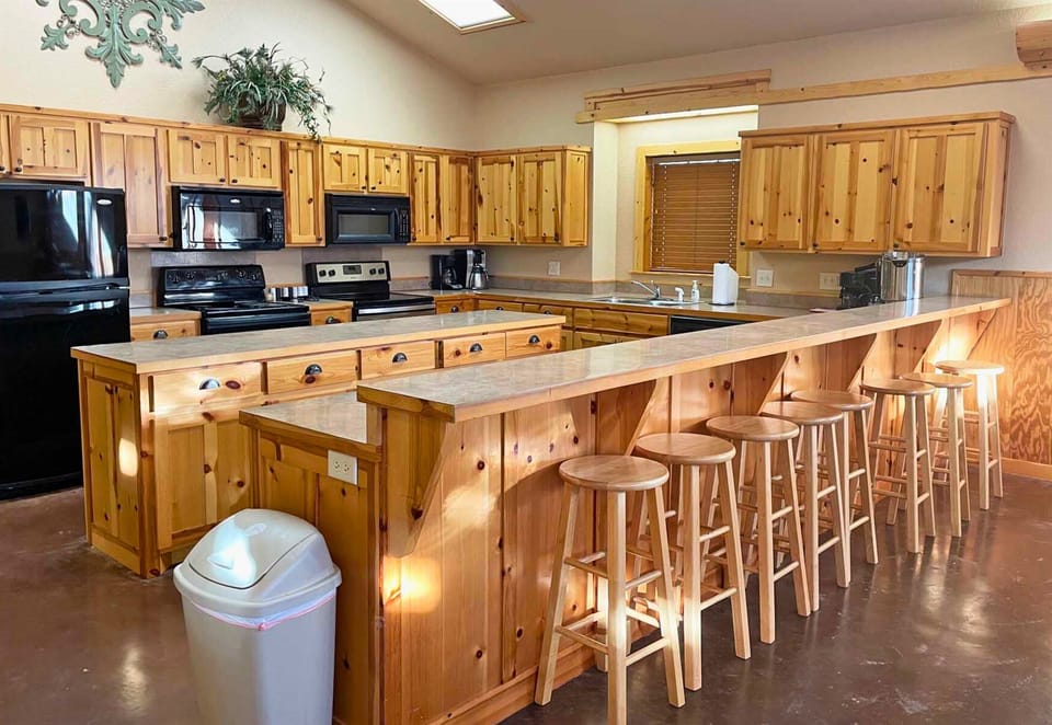 Community kitchen with bar seating for group meals.