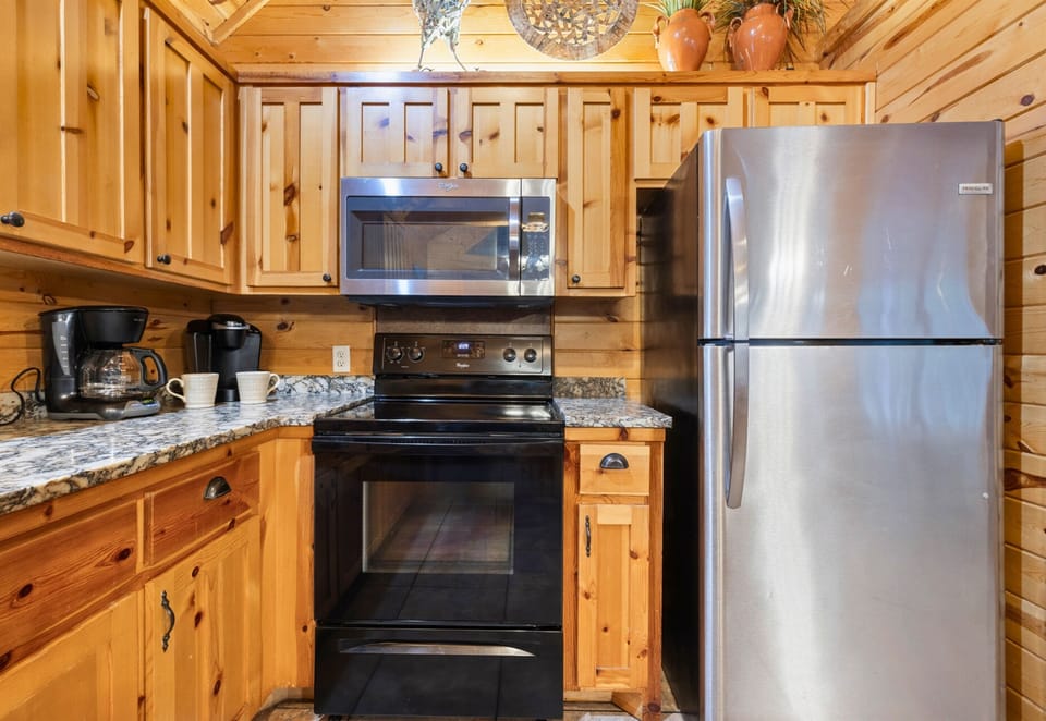 Full kitchen with stainless steel appliances—cook with ease.