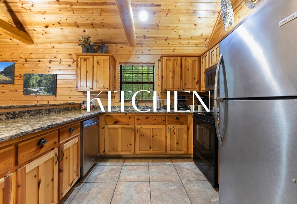 Kitchen stocked with modern appliances and rustic charm.