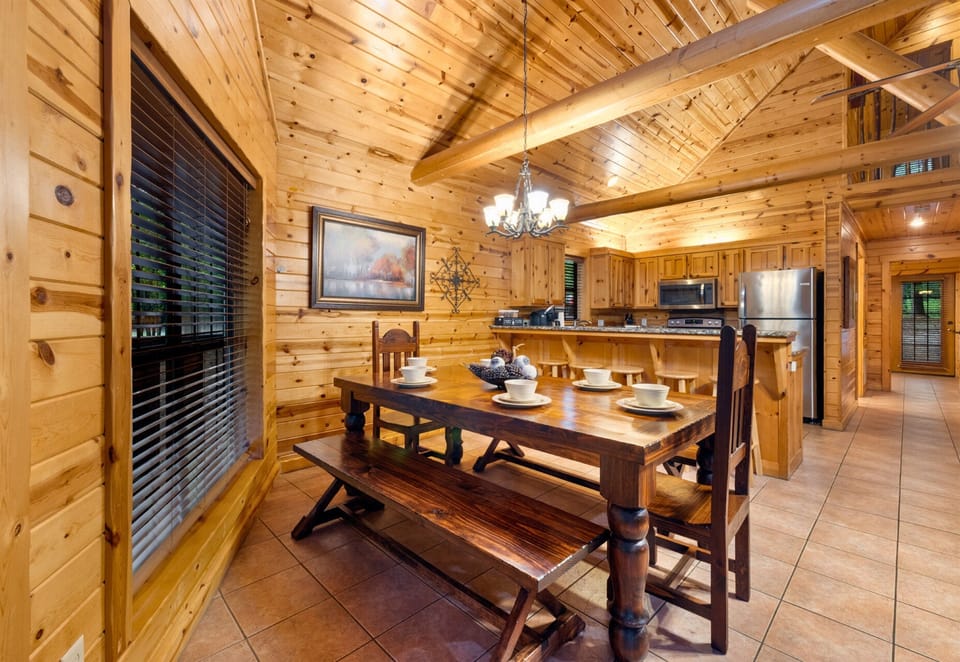 Spacious dining room with warm wood finishes and big windows.