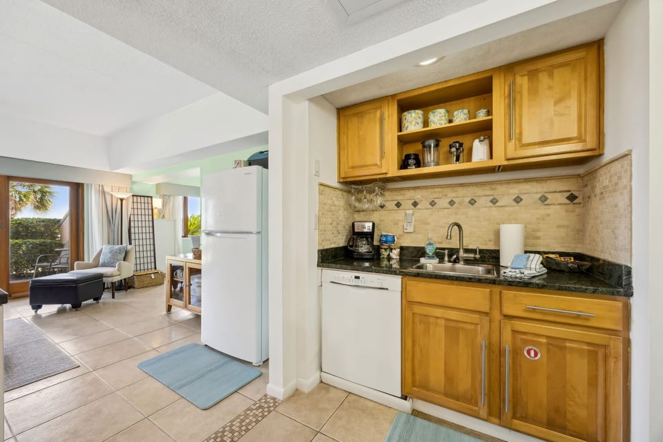 Compact kitchen stocked with all the essentials including a drip coffeemaker