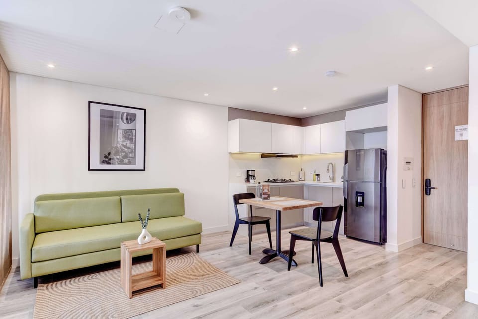 Living area with sofa bed and dining table