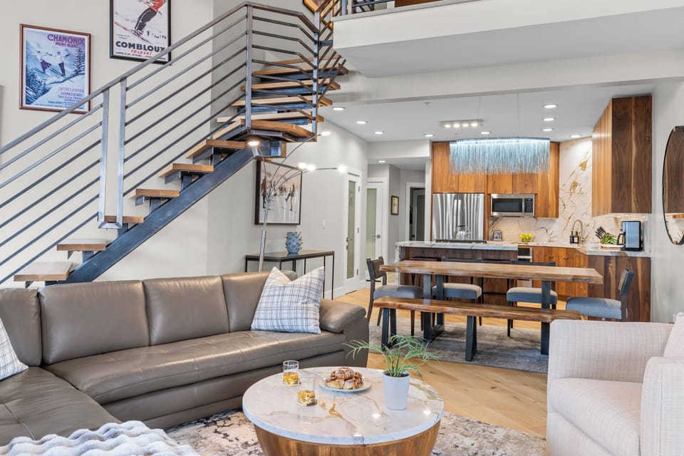 Bright, inviting living room with a cozy fireplace, perfect for relaxing evenings.