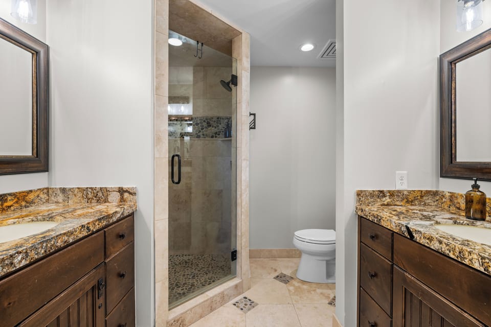 Primary's ensuite bathroom features a shower.