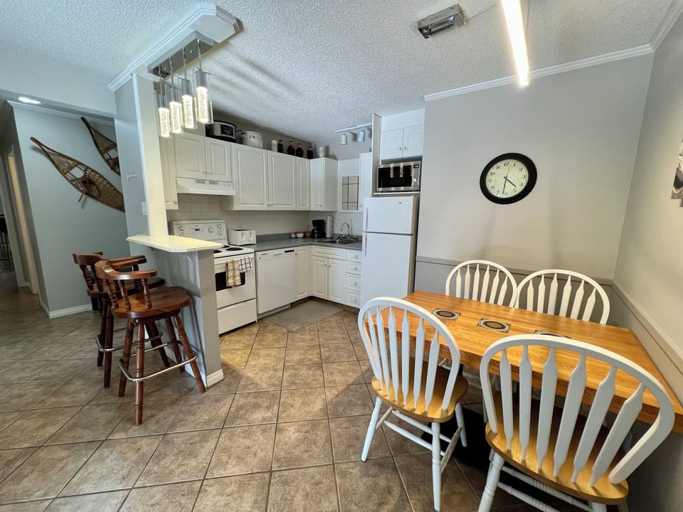 Open plan living, with kitchen, dining and living area.