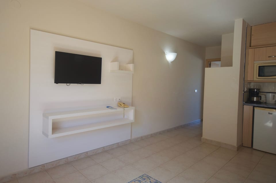 Classic Room, Balcony, Partial Sea View | In-room safe, bed sheets