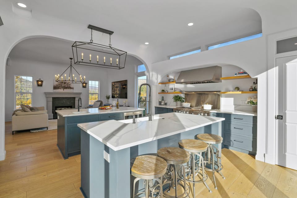 Experience modern luxury in this stunning open-concept home. Featuring a gourmet kitchen with dual islands, perfect for entertaining, and a cozy living area with a fireplace. Your dream getaway awaits!