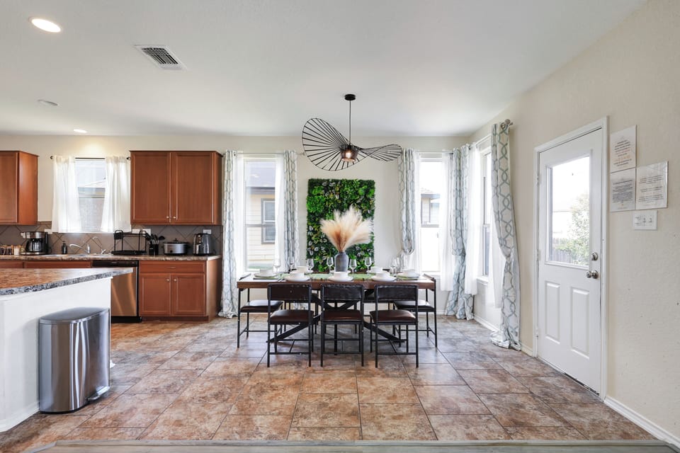 Spacious dining table that sits 8 with full tableware and silverware included. 