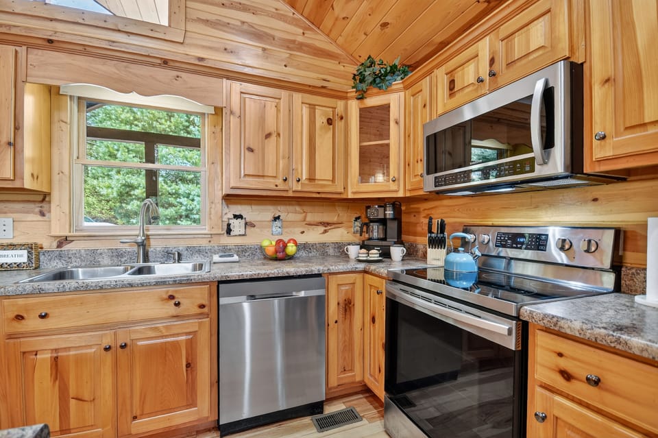 Fully-stocked kitchen with stainless steel and granite countertops