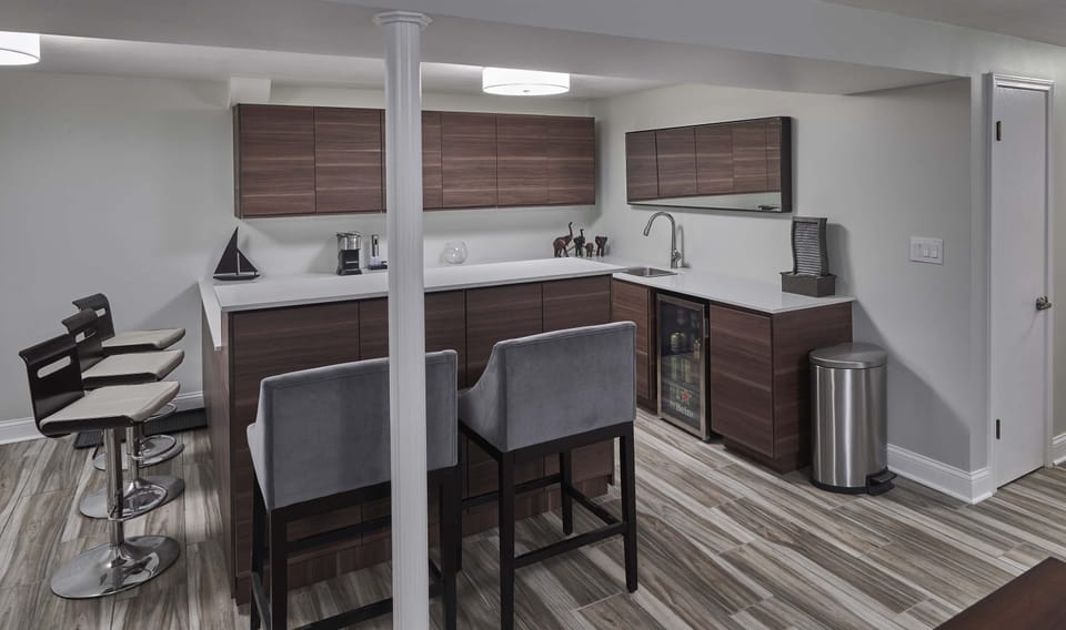 Prepare refreshing beverages & scrumptious snacks at the lower-level wet bar!​