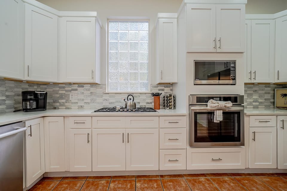 Bright, modern kitchen with sleek appliances and ample storage