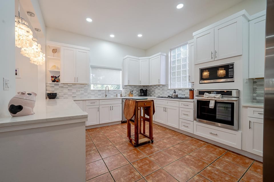 Spacious kitchen with modern appliances and bright natural light