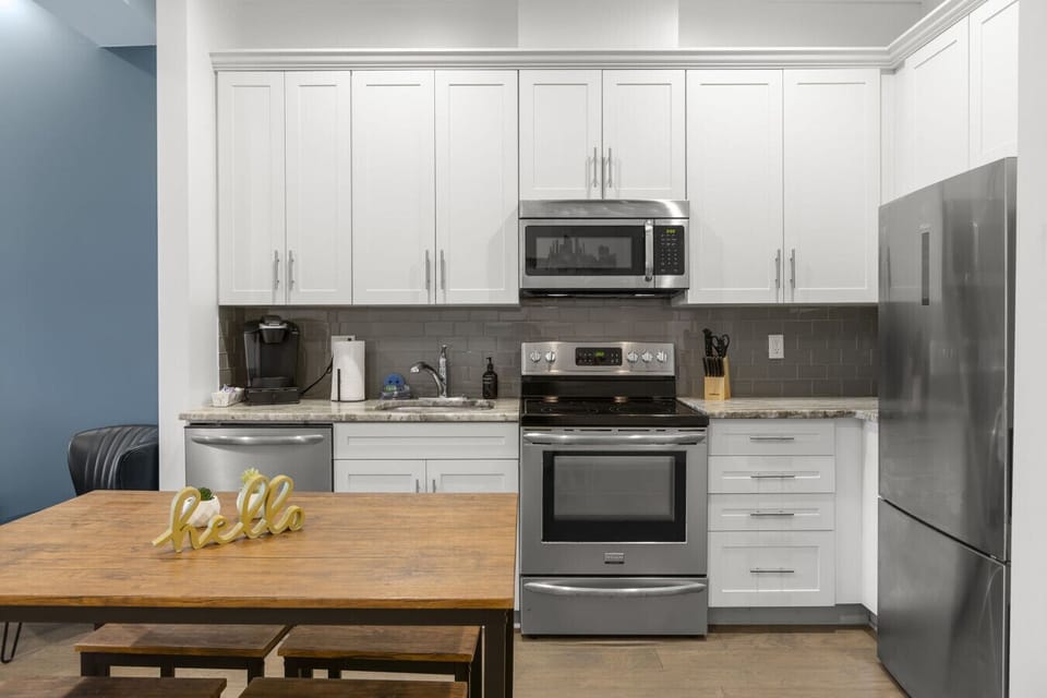 Kitchen includes, stove, oven, microewave, Keurig, fridge, freezer, ice maker, dishwasher, Brita pitcher, and all the cookware and silverware you need
