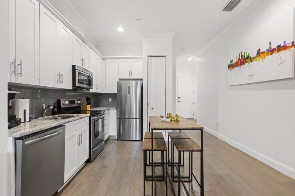 Open concept, fully equipped kitchen with stainless steel appliances. Coffee supplies, salt, pepper, and olive oil are provided for our guests