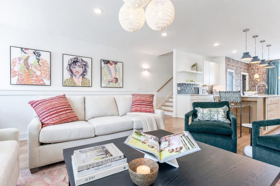 Pendant lights hang over the living room coffee table: the heart of the house where your group naturally gathers between adventures in Germantown