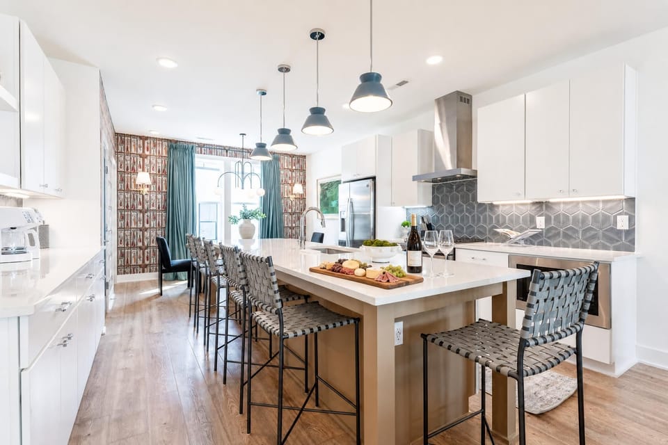 The kitchen island and bar stools become breakfast central and pre-game headquarters, easy to cook together and sit face-to-face