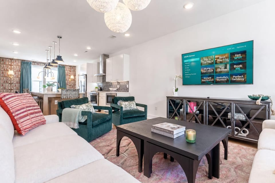 The open kitchen and living room merge into one space, so whoever's cooking stays part of the conversation during movie nights and group hangs