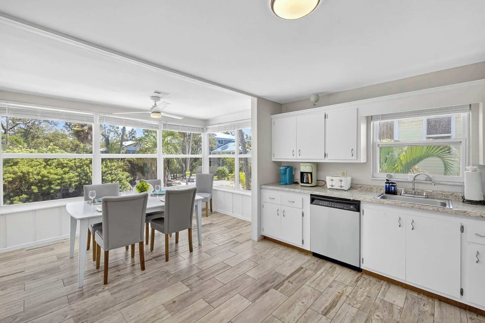 Kitchen and dining area are light and bright so many windows