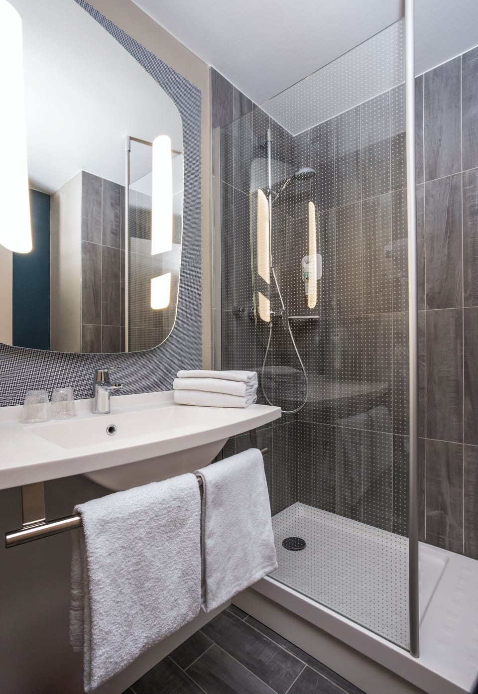 Shower, eco-friendly toiletries, hair dryer, towels