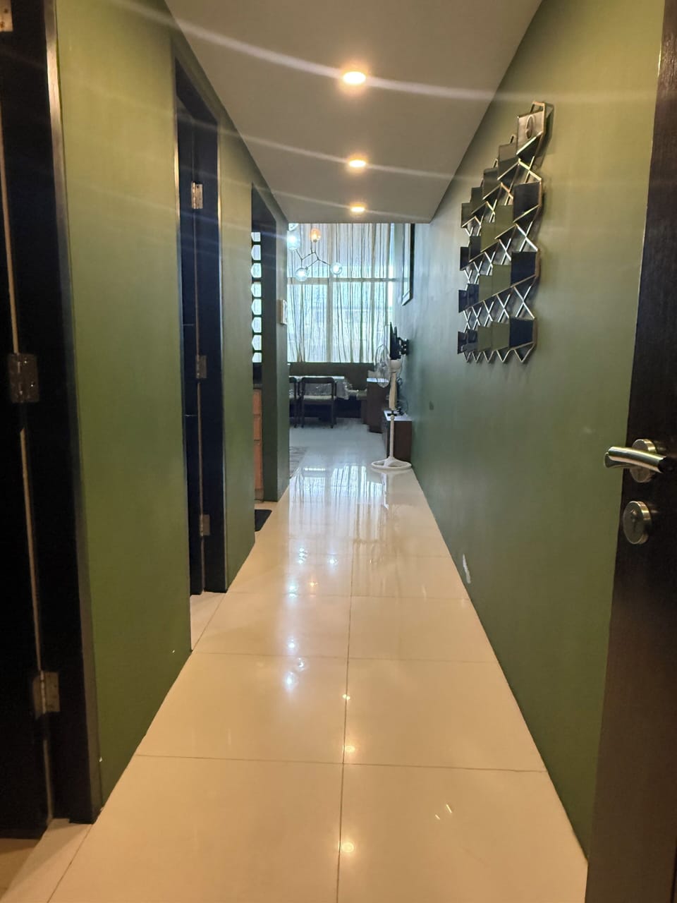 Your spacious loft-style unit awaits beyond the welcoming hallway.