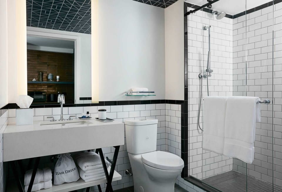 Designer toiletries, hair dryer, towels, soap