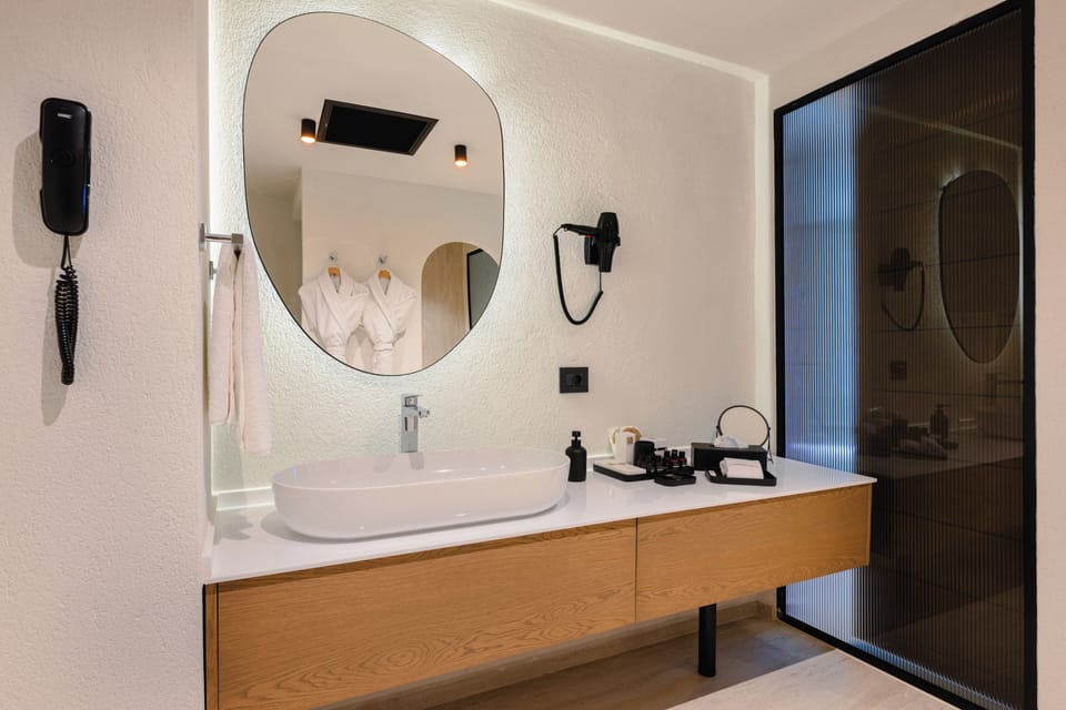 Premium Suite, Terrace, Sea View | Bathroom | Shower, free toiletries, hair dryer, slippers