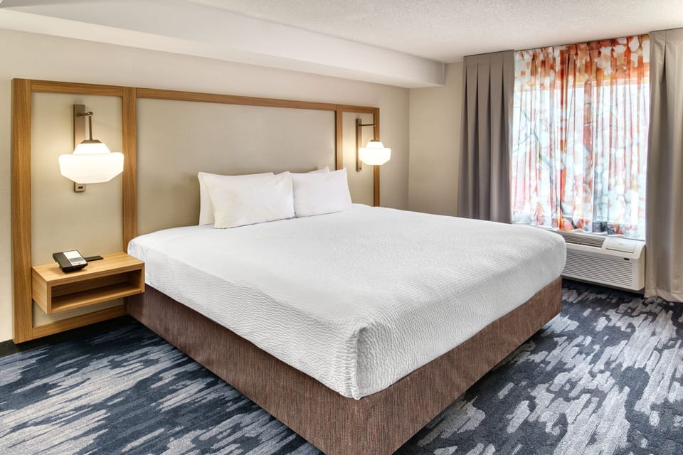 Premium bedding, desk, blackout drapes, iron/ironing board