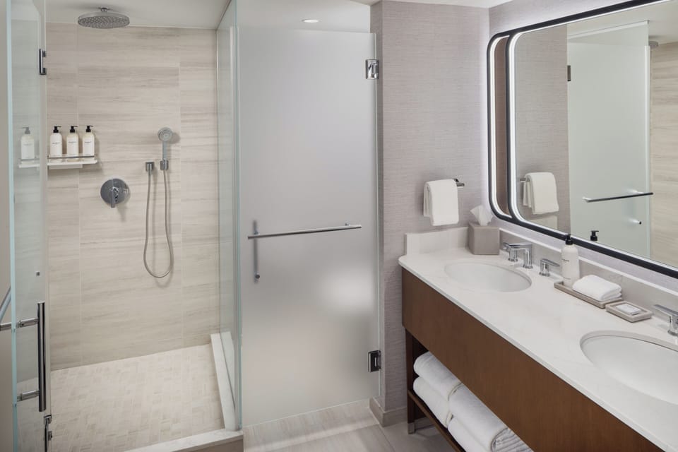 Separate tub and shower, designer toiletries, hair dryer, bathrobes
