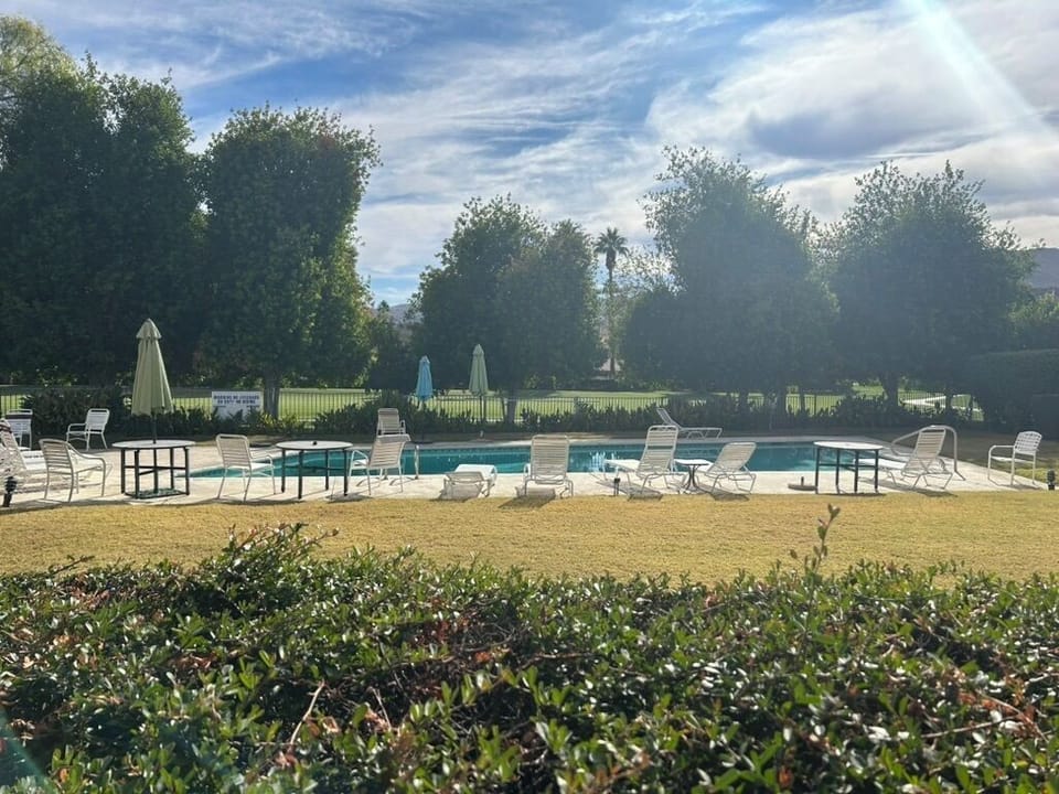 View of Pool from patio hot tub is to the left off photo.