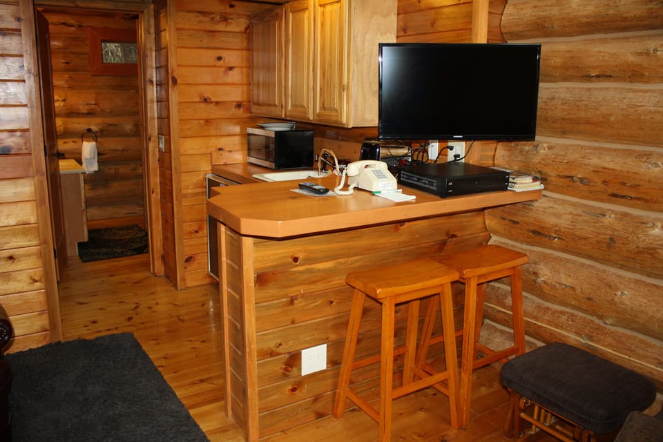 Exclusive Cabin, 2 Bedrooms, Kitchenette, River View | Living area | 50-inch flat-screen TV with satellite channels, TV