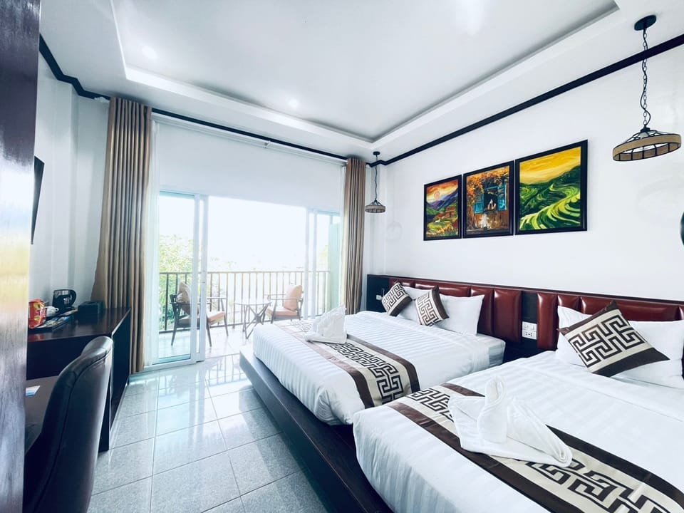 Family Triple Room, River View | Free minibar items, in-room safe, desk, laptop workspace