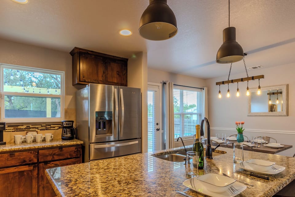 Enjoy a fully stocked kitchen w/ coffee bar and table perfect for meals or games
