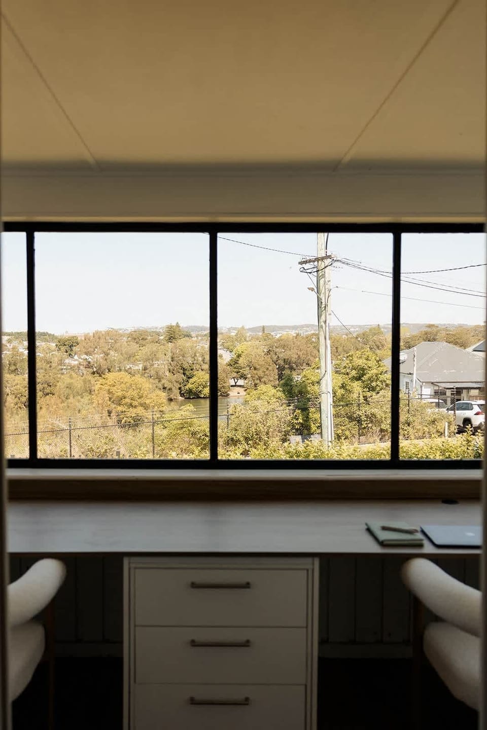 Spacious home office for two, with closing door for privacy. Bright, light-filled space overlooking Throsby Creek – perfect for working remotely.